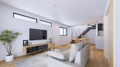 リビングの完成イメージパース。約22帖のリビング空間に2階へのストリップ階段が設置されておりより開放的なリビングに。