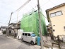 緑のシートに覆われた、これから生まれ変わる住まい