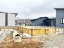建ち上がる住まいの礎、確かな未来を築く空間。