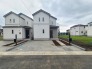 E号棟 洗練されたフォルムが街並みに馴染み、穏やかな日常の始まりを予感させる佇まいです。